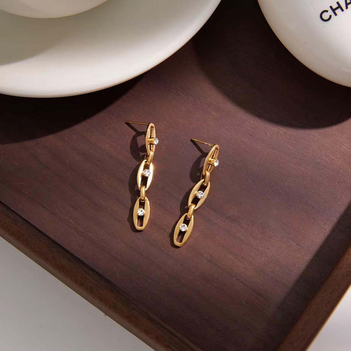 Boucles d'oreilles Galaxia – vue posée sur plateau bois